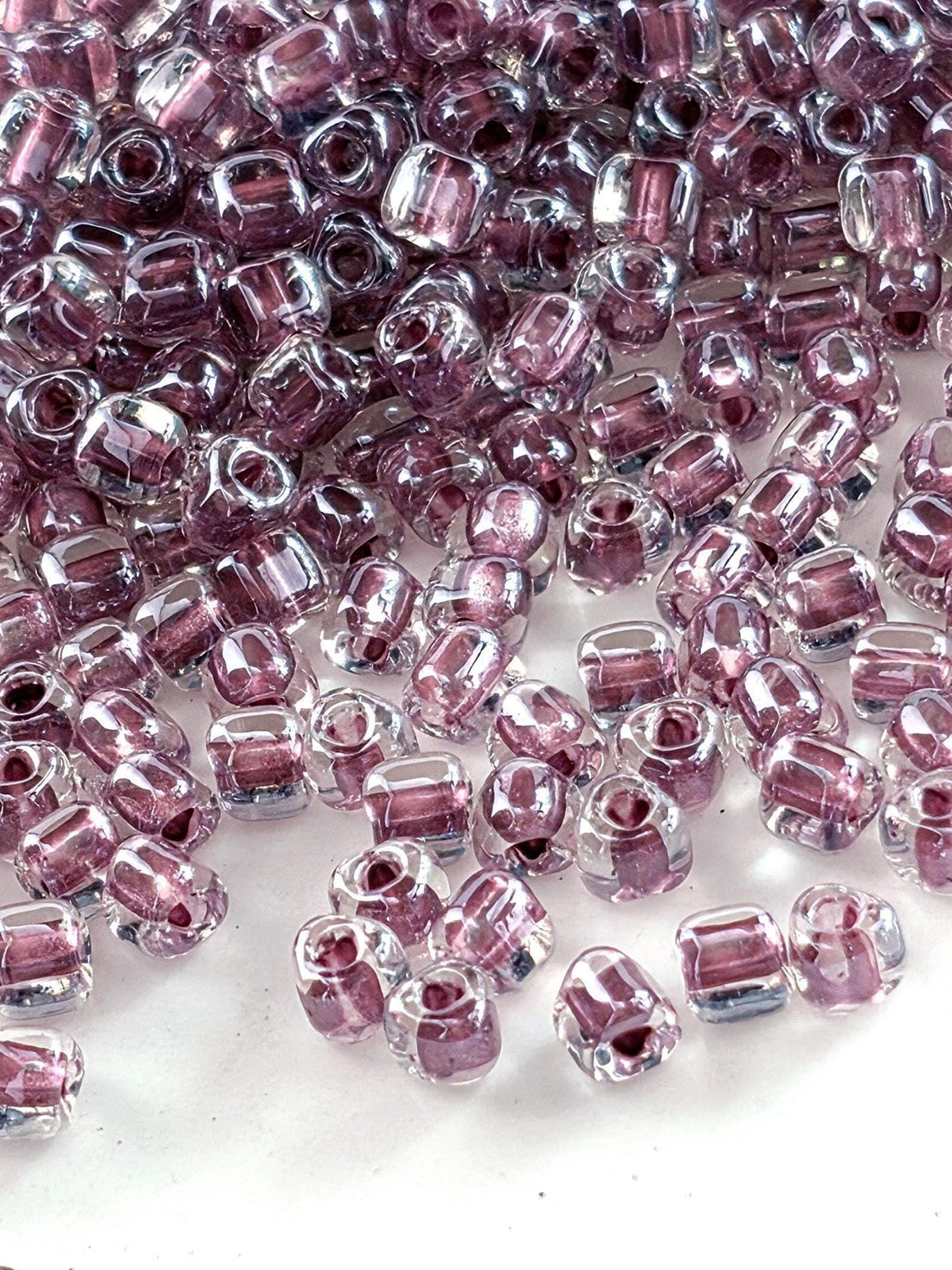 Miyuki Triangle Beads, Crystal/Dark Mauve Inside Color Lined Sparkle | 8/0 | 15g Pack