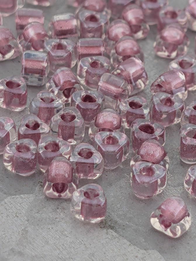 Miyuki Triangle Beads, Crystal/Mauve Inside Color Lined Sparkle | 5/0 | 15g Pack