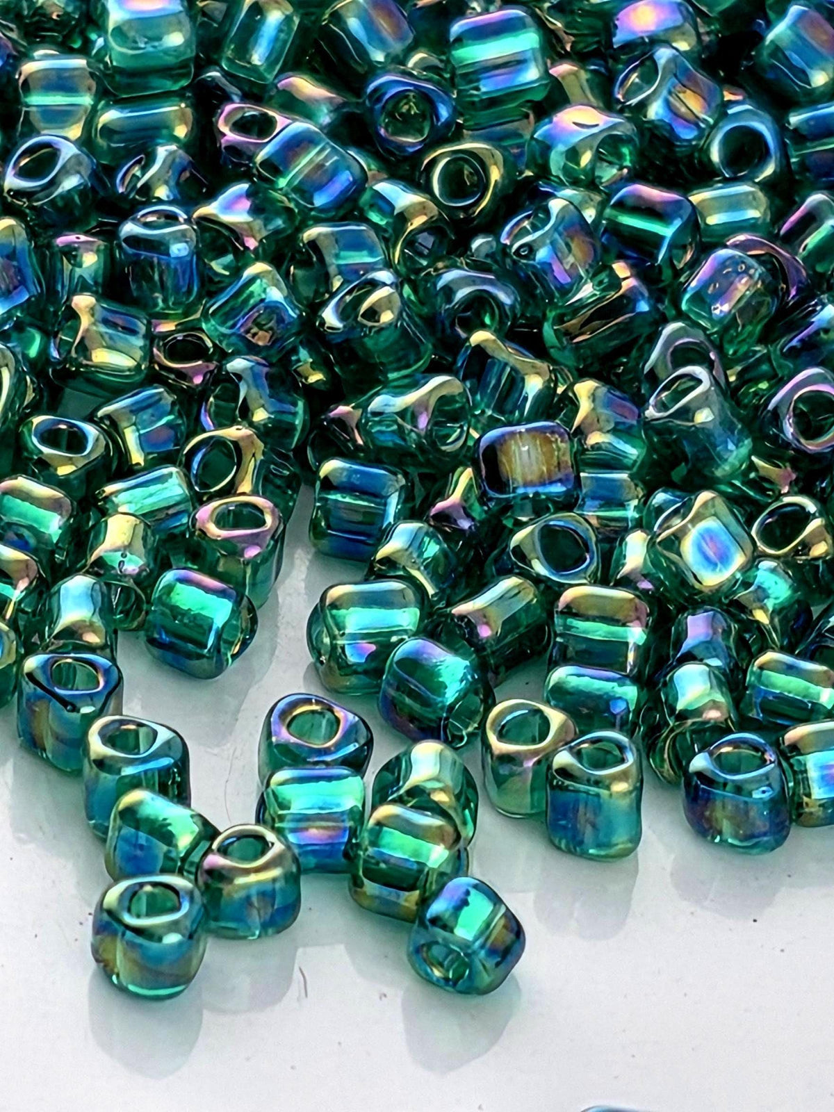 Miyuki Triangle Beads, Med Green Inside Color Lined Sparkle | 10/0 | 15g