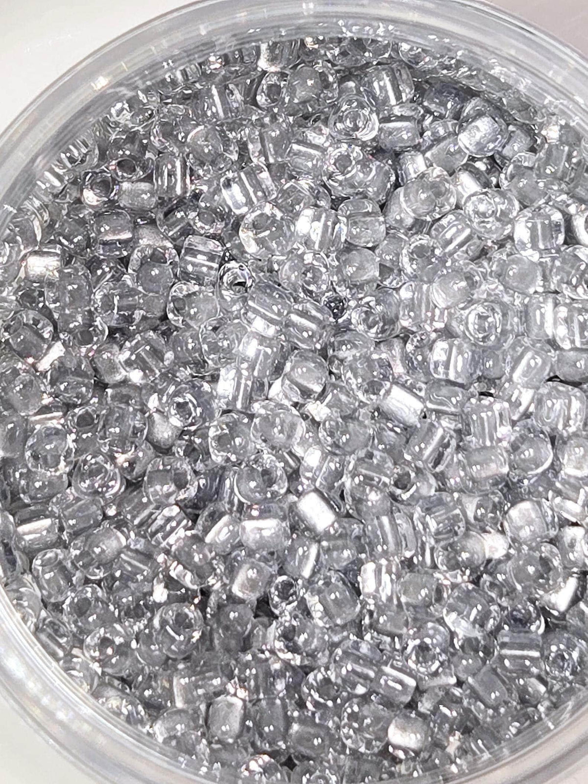 Miyuki Triangle Beads, Crystal Silver Inside Color Lined | 8/0 | 15g Pack