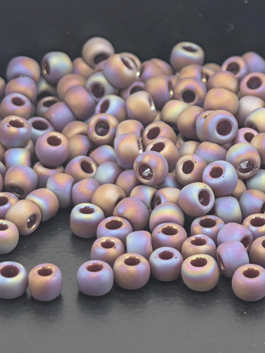 Toho Round Beads, Opaque-Rainbow-Frosted Oxblood | 8/0 | 8g Pack