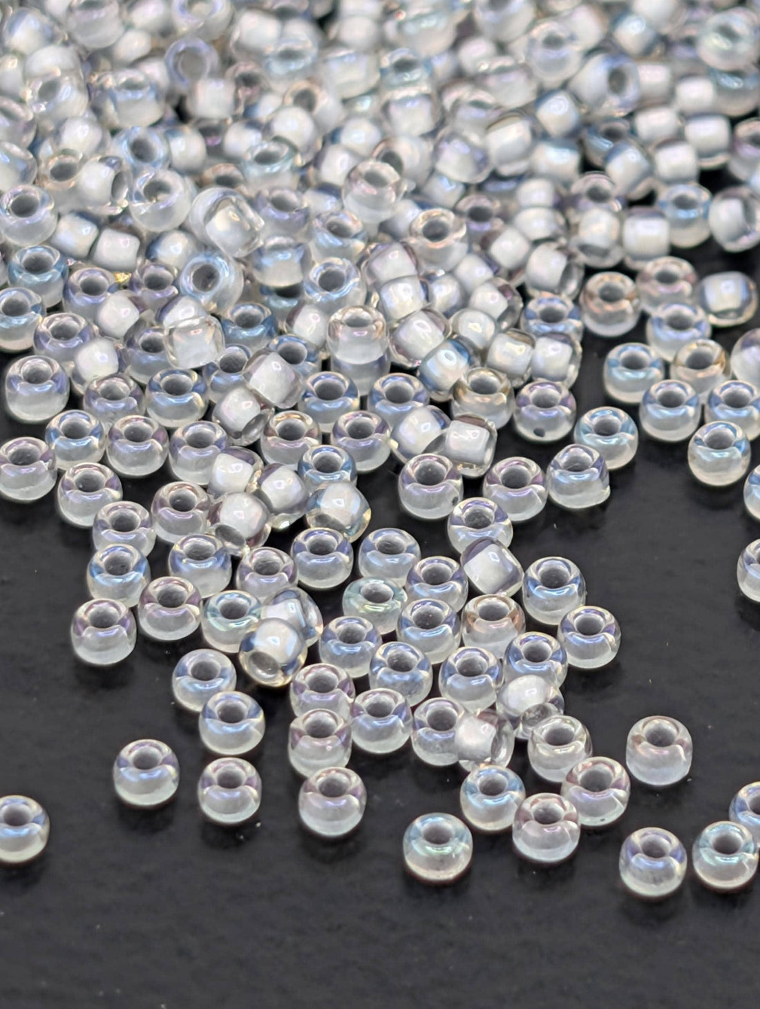 Toho Round Beads, Rainbow Crystal/Gray-L | 15/0 | 8g Pack