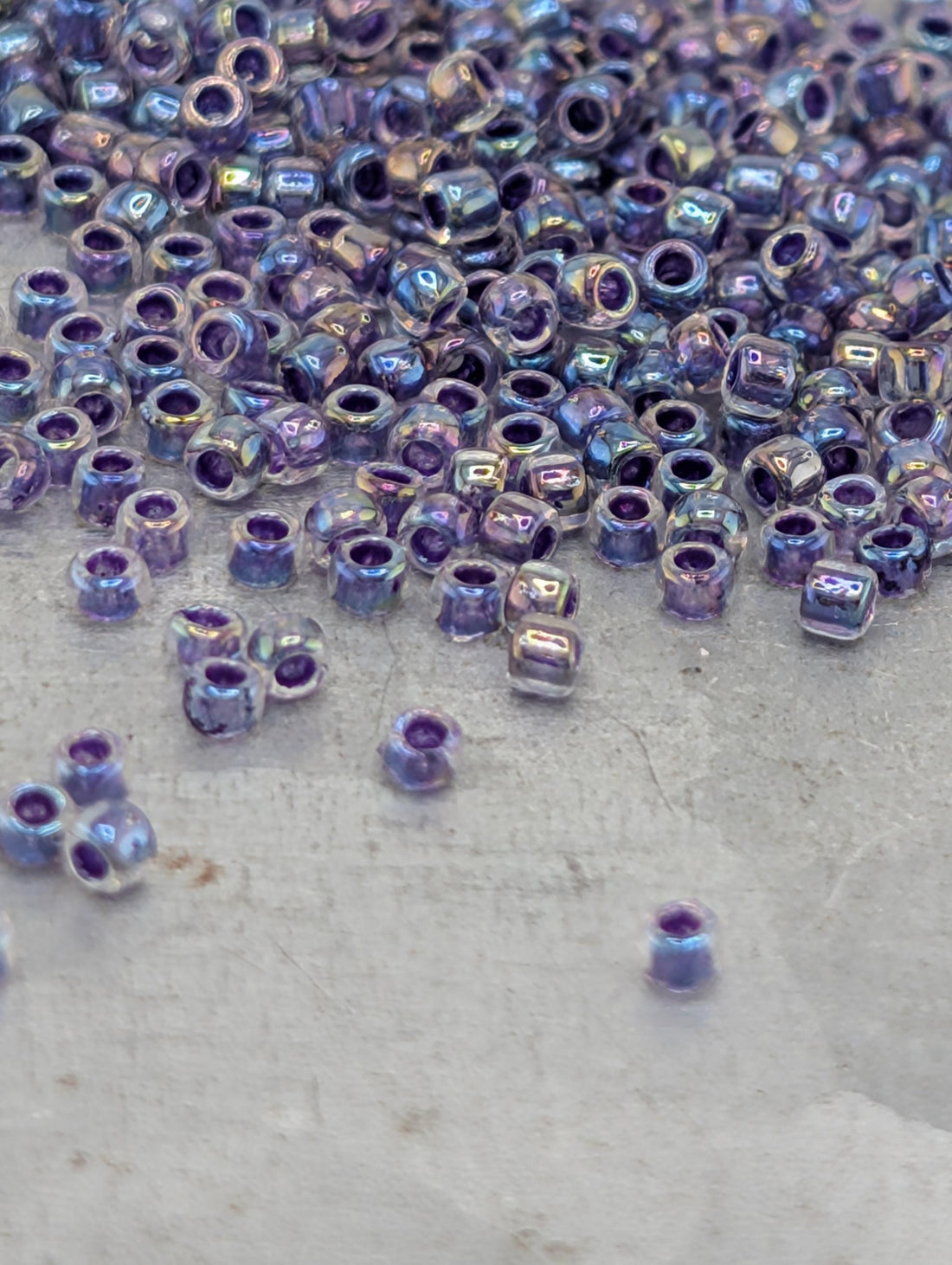 Toho Round Beads, Rainbow Crystal/Grape | 15/0 | 8g Pack