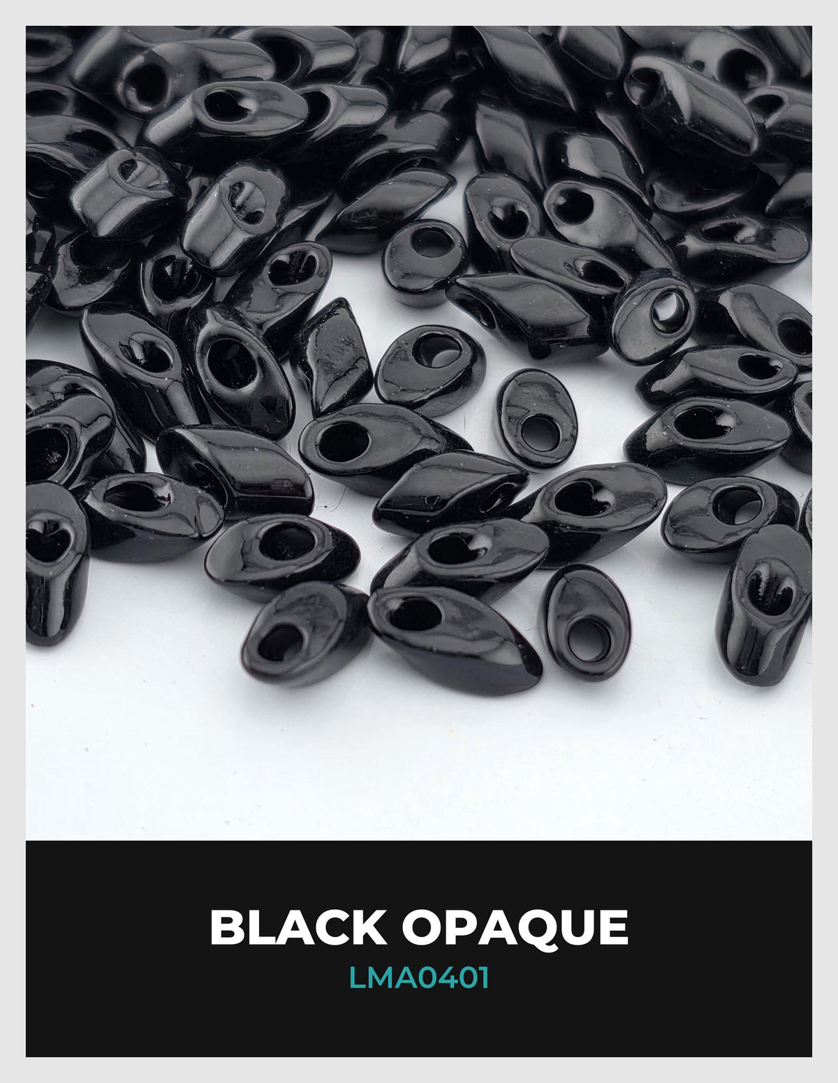 a collection of black beads or buttons scattered on a white background.