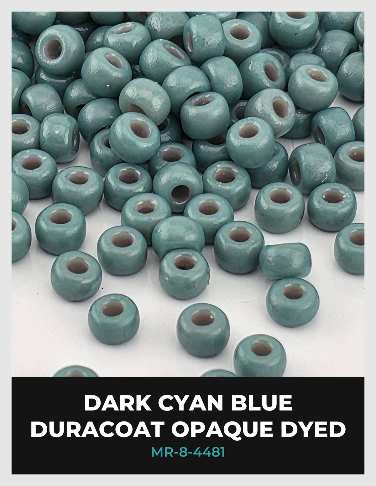 a collection of turquoise beads, some of which appear to be dyed in a dark blue color. The beads are scattered across a white background, creating a visually striking contrast.