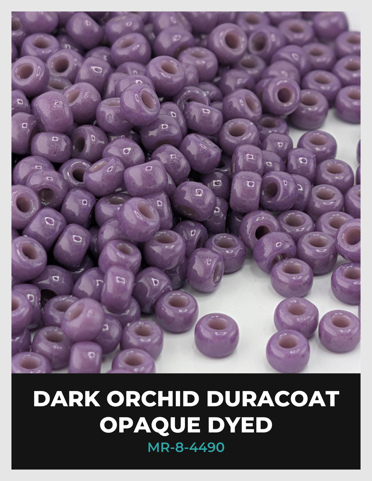 a large pile of purple beads, likely made of glass or plastic, arranged in a visually appealing manner.