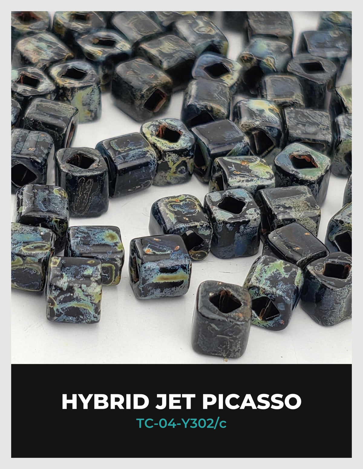 The image is a close-up of numerous black and blue beads or stones, possibly resembling a piece of art or a decorative item.