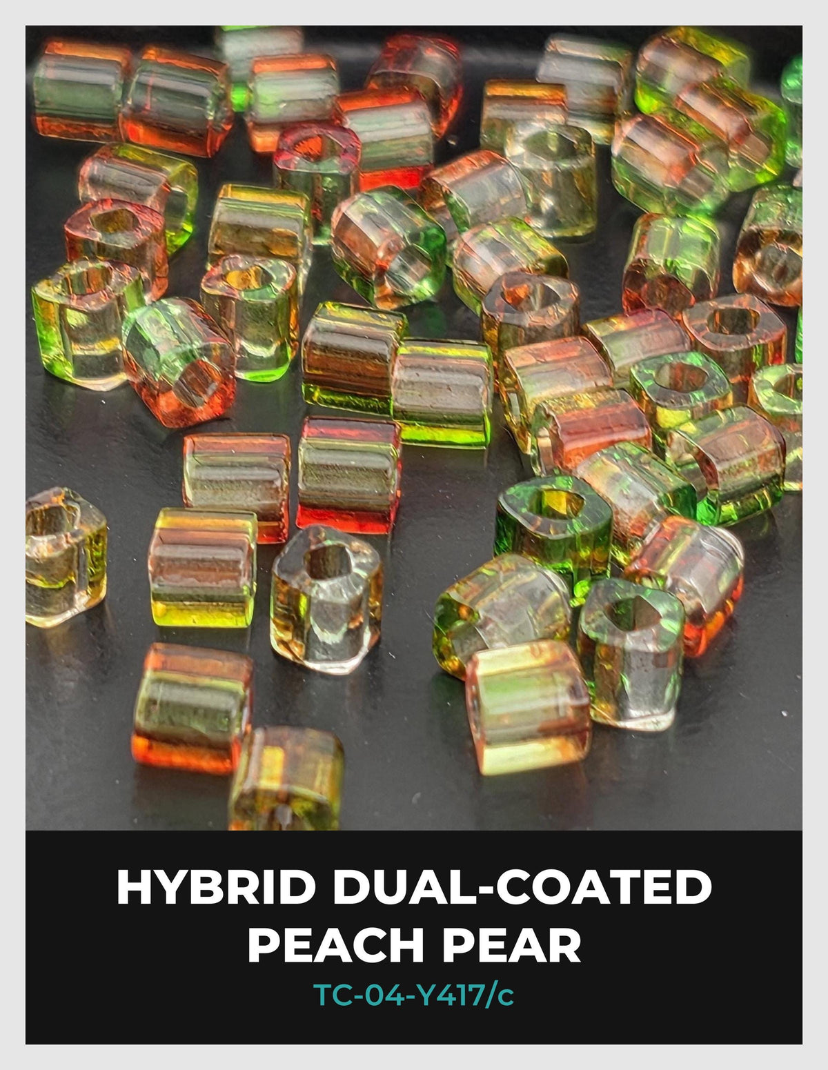 a collection of colorful glass beads, including peach pear and hybrid dual-coated beads, scattered on a dark surface.