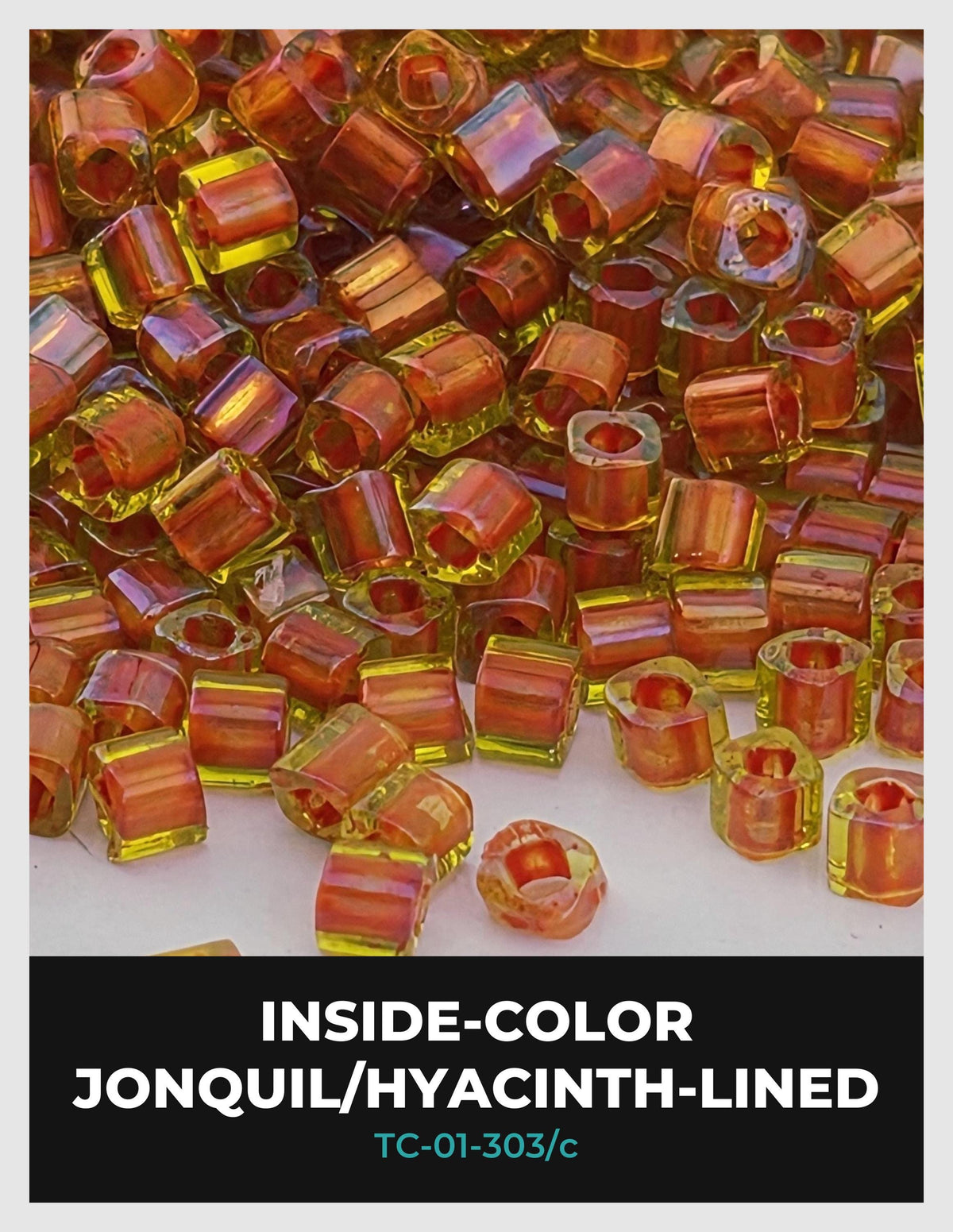 The image is a close-up of numerous small, colorful beads or stones, possibly jonquil or hyacinth-lined, scattered across a surface.
