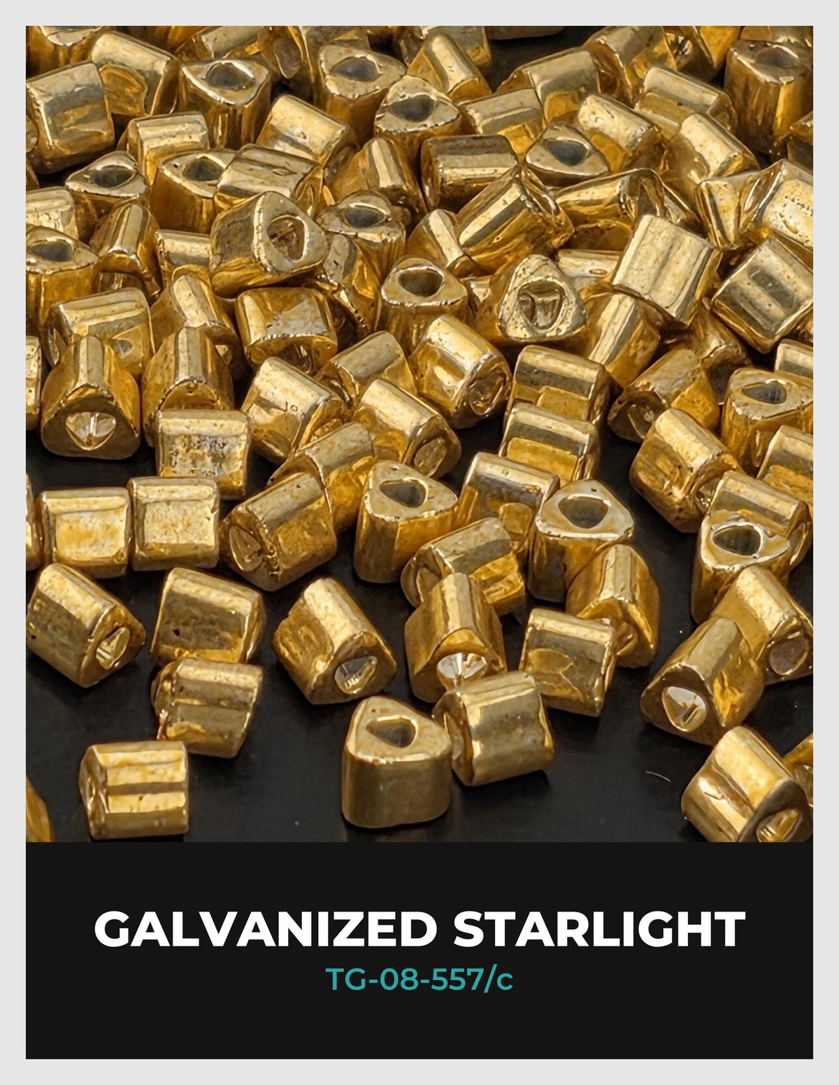 a collection of small, shiny, metallic objects that appear to be gold or silver in color. They are scattered across a dark background, creating a visually striking contrast.