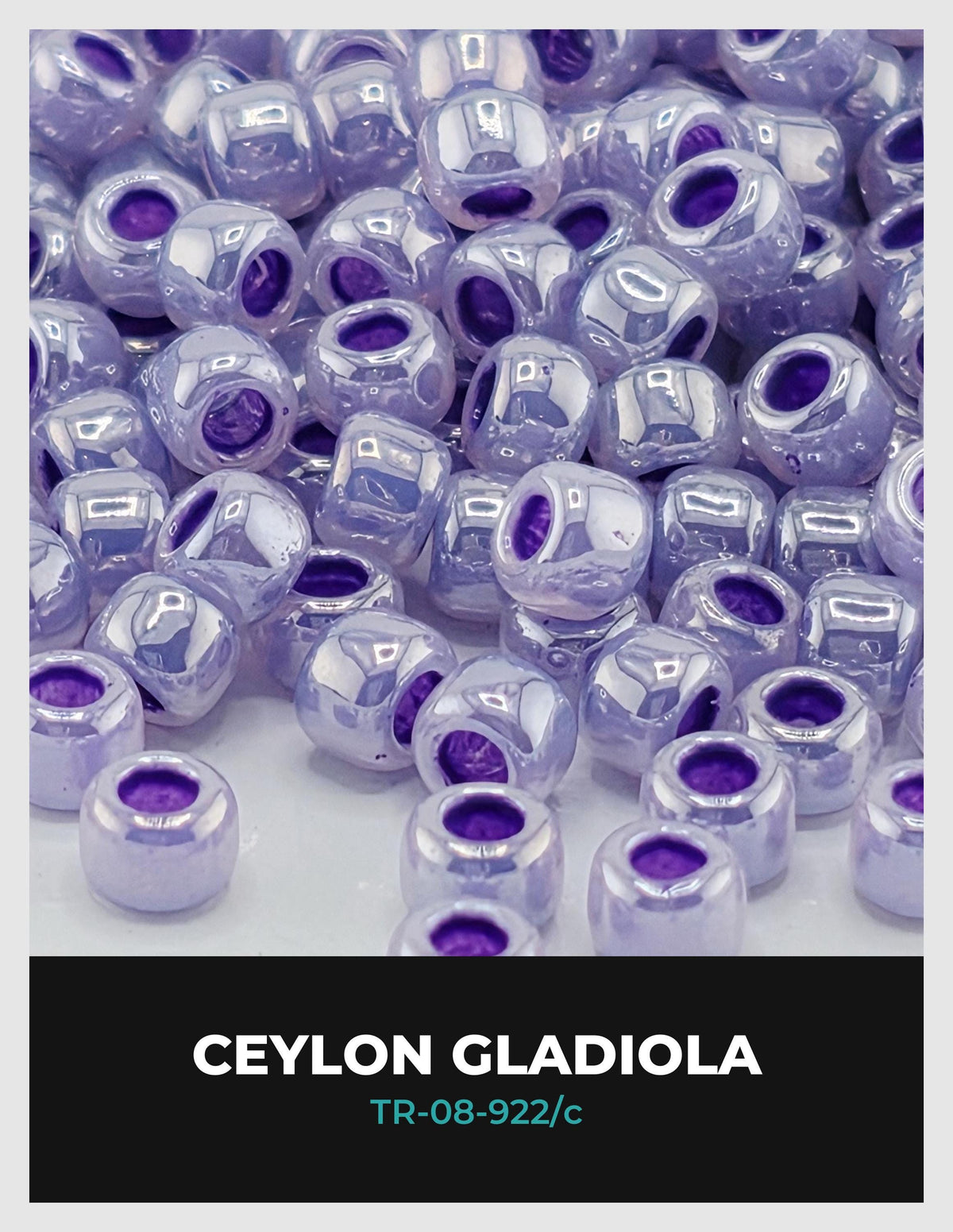 The image is a close-up of numerous small, round beads in shades of purple, with some having a metallic sheen. The text "CEYLON GLADIOLA" is visible, along with the text "TR-08-922/c" in the bottom right corner.