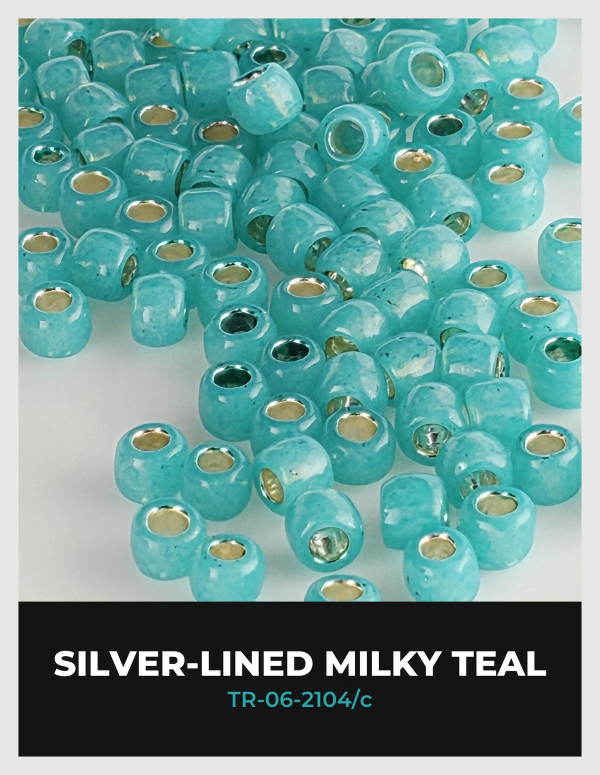 a collection of turquoise-colored beads or beads with silver-colored holes, arranged in a visually appealing manner.