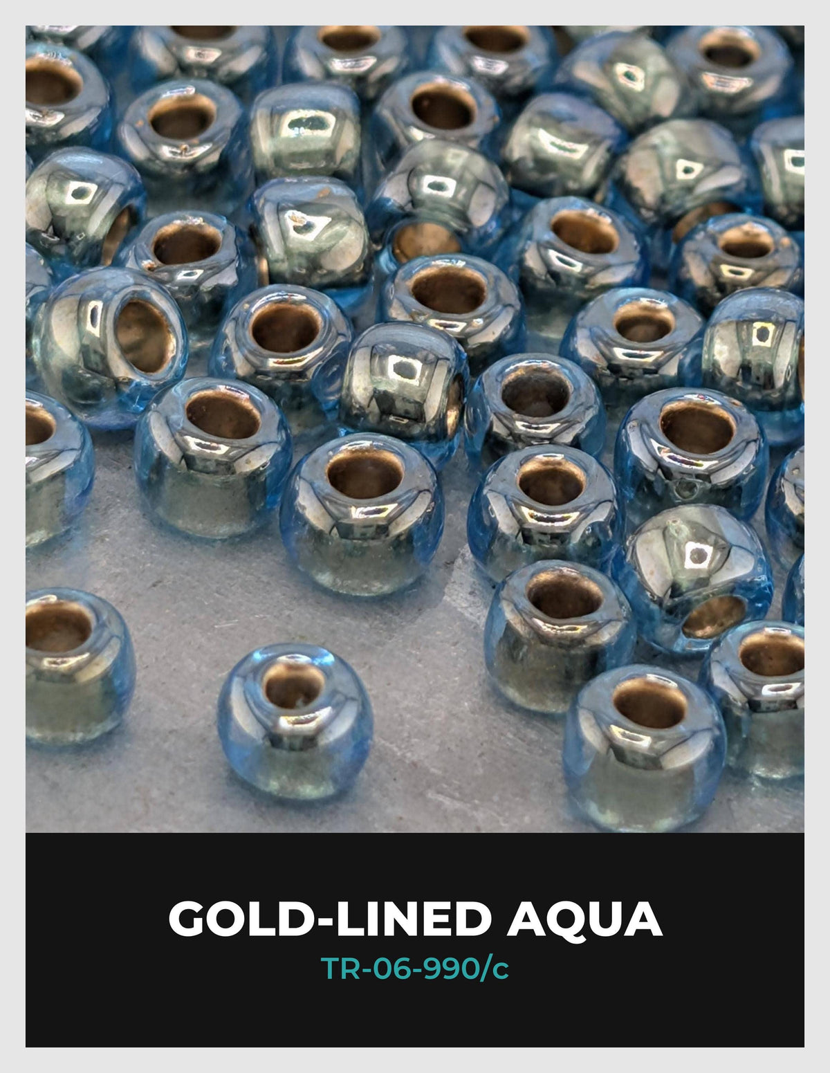 a collection of small, round, blue glass beads arranged in a pattern, with some of the beads appearing to be gold-lined.