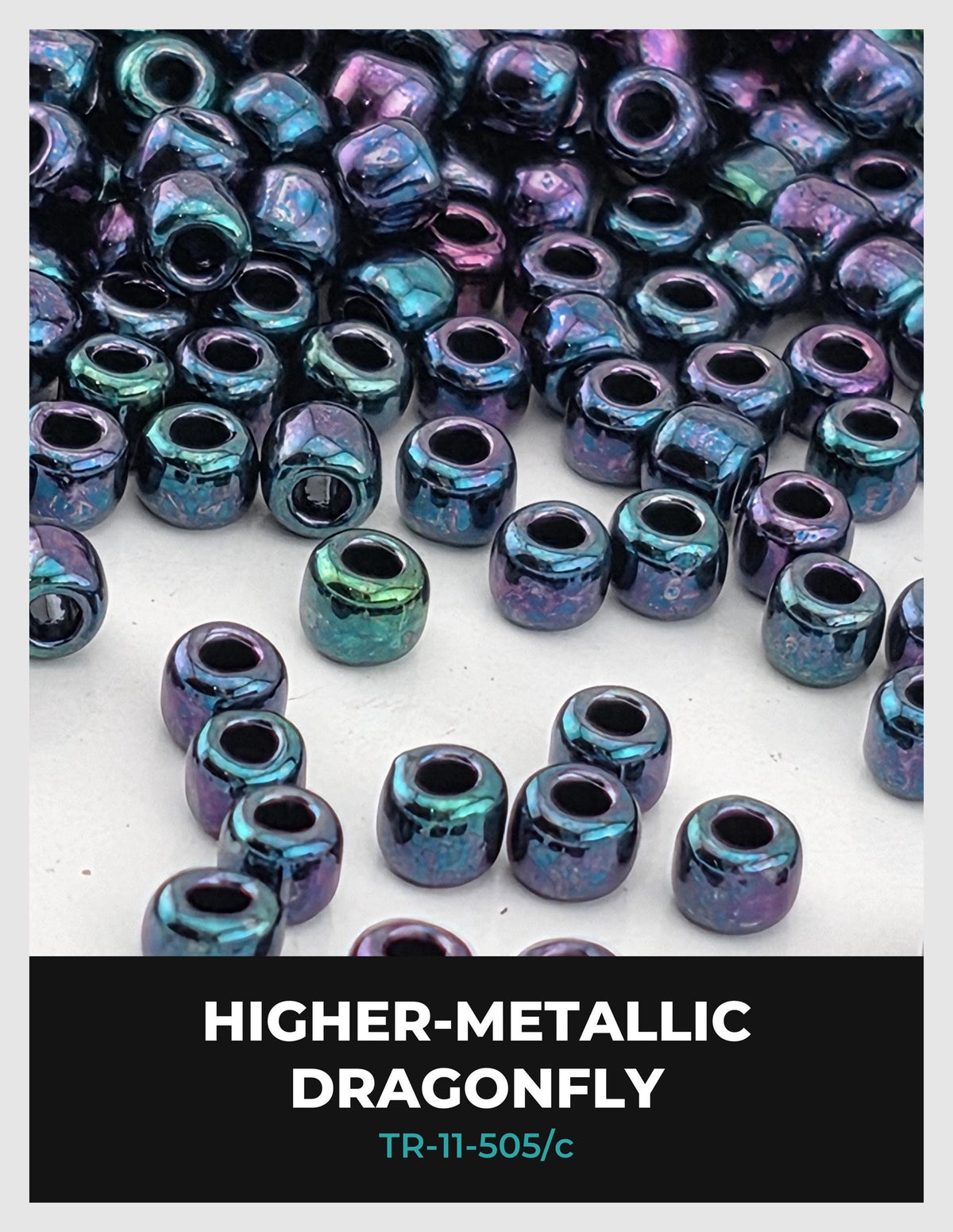 a collection of metallic beads, specifically dragonfly-shaped, with a variety of colors including blue, green, and purple.