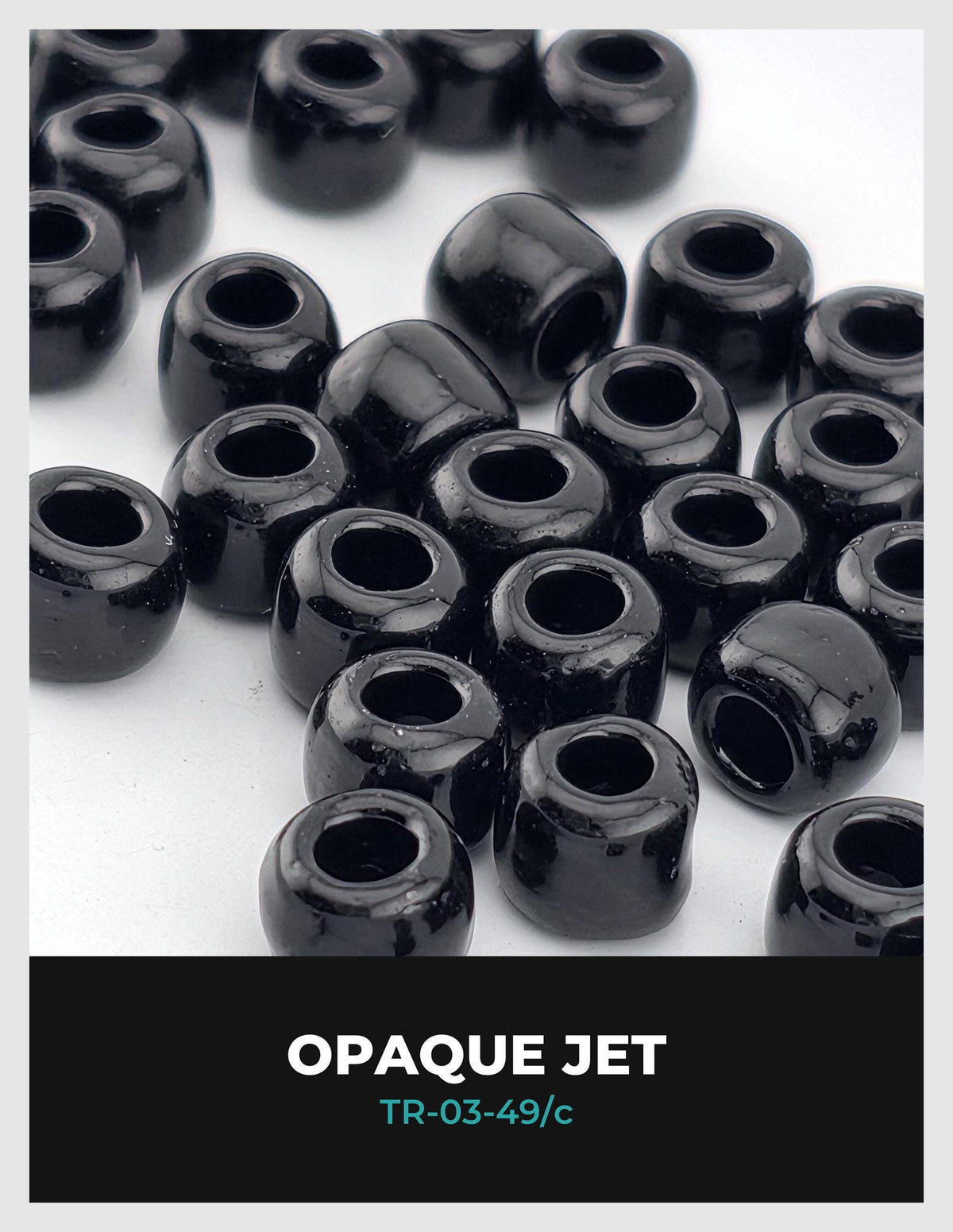 a collection of black, shiny beads or beads in various sizes and shapes, arranged in a visually appealing manner.