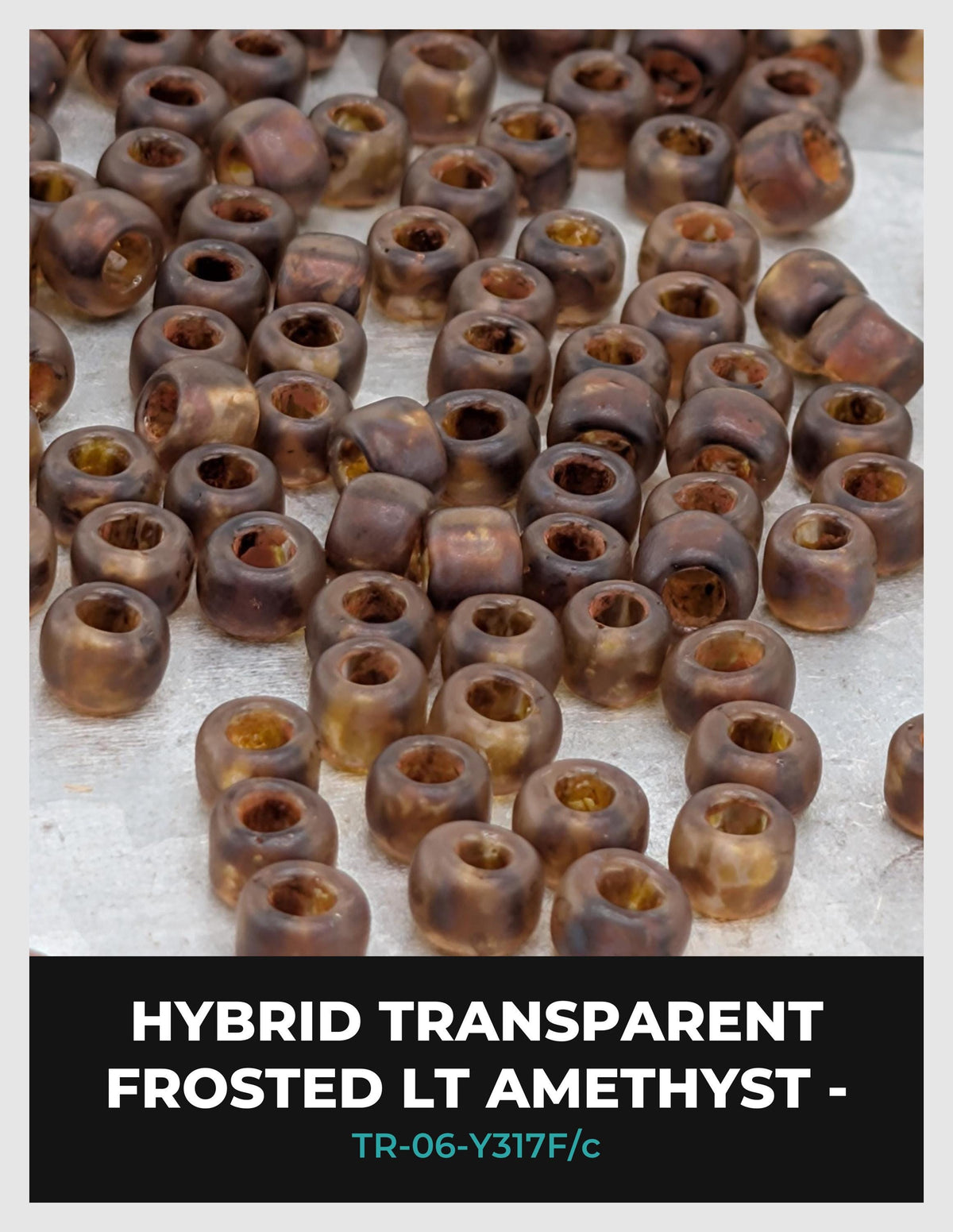 a collection of brown, frosted, and transparent amethyst beads arranged on a white surface.