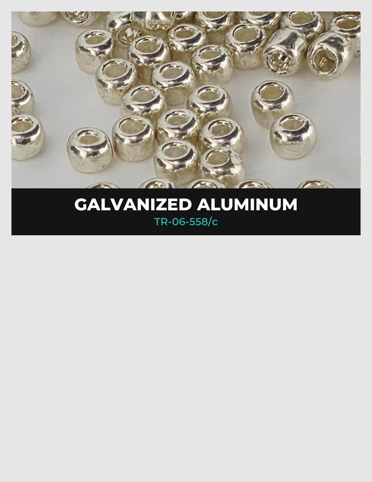 a collection of small, shiny, metallic objects, likely made of aluminum, scattered across a white background.