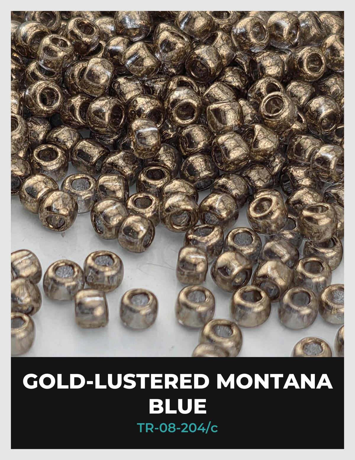 a collection of small, shiny metal beads in various shades of blue, scattered across a surface.