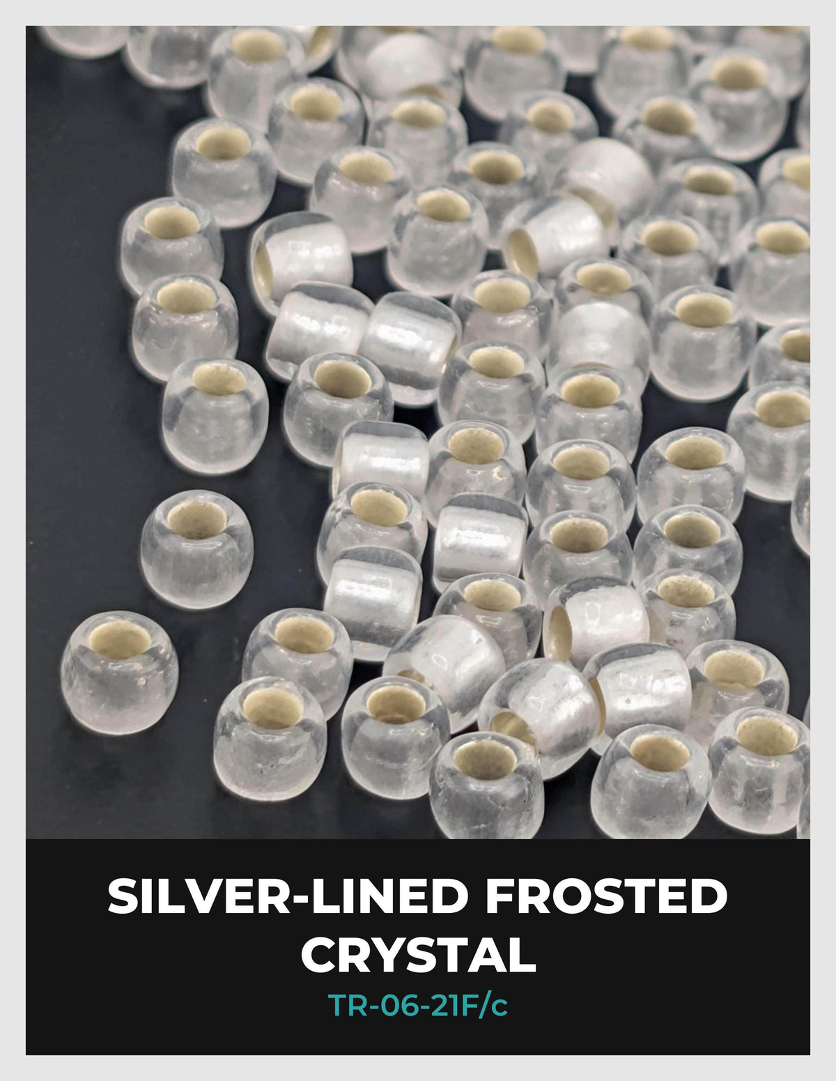 a collection of clear crystal beads with a silver lining, arranged in a visually appealing manner.
