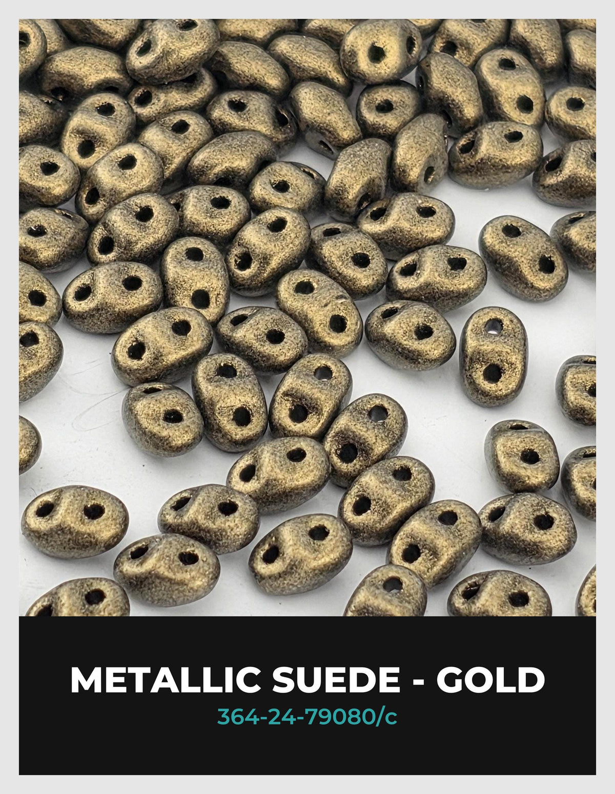 a collection of small, metallic-looking beads in various shades of gold, scattered across a white background.
