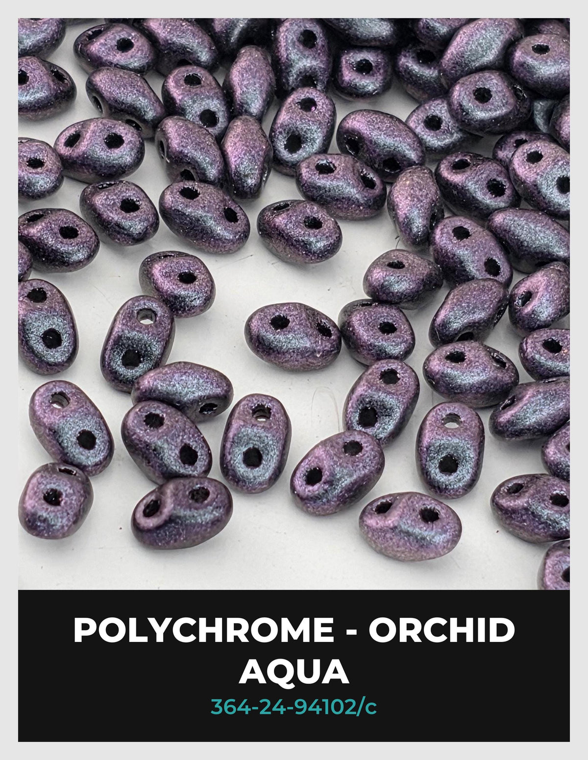 a collection of purple orchid-colored beads scattered on a white background.