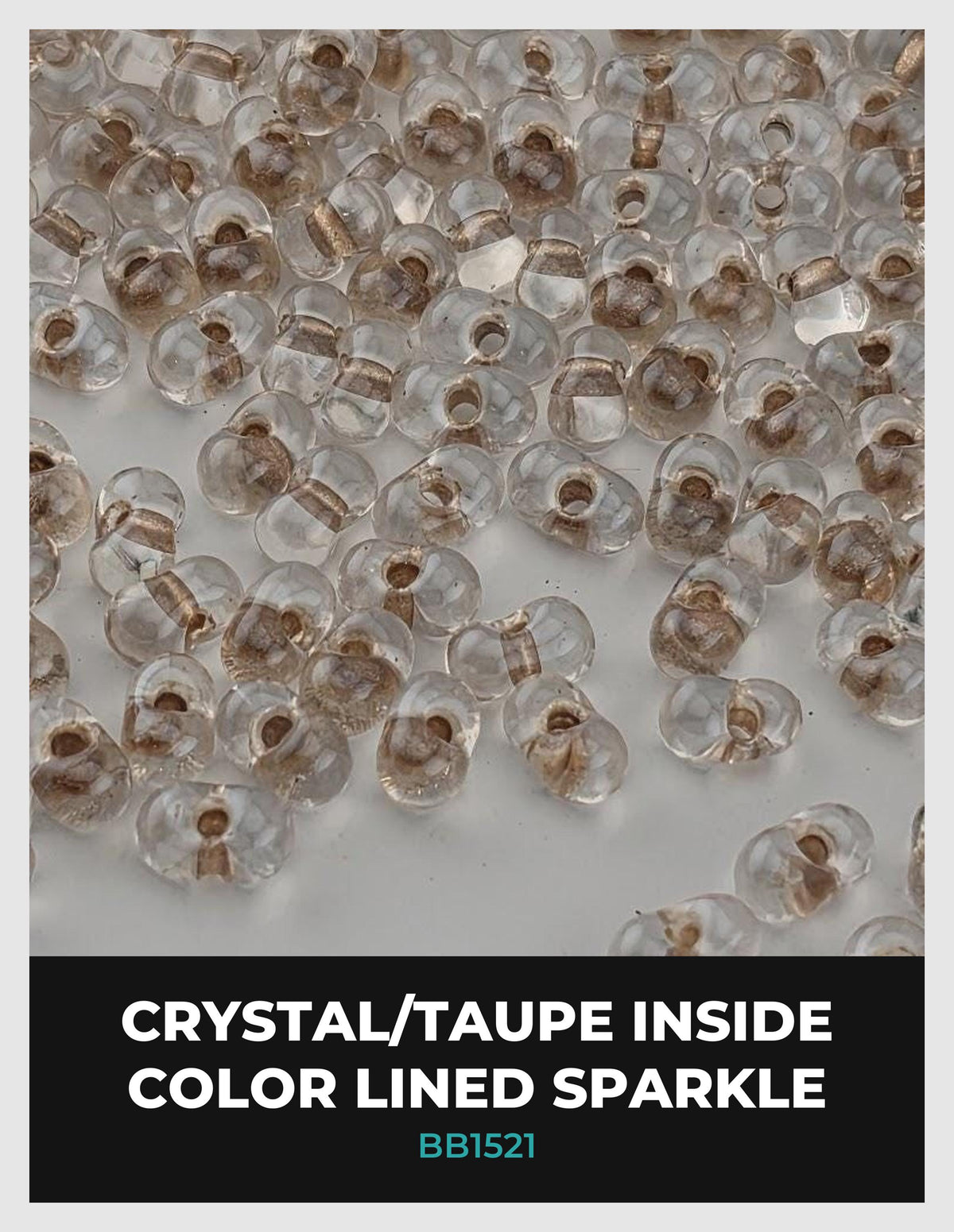 a collection of clear glass beads with a metallic, taupe-colored interior lining, arranged in a visually appealing manner.