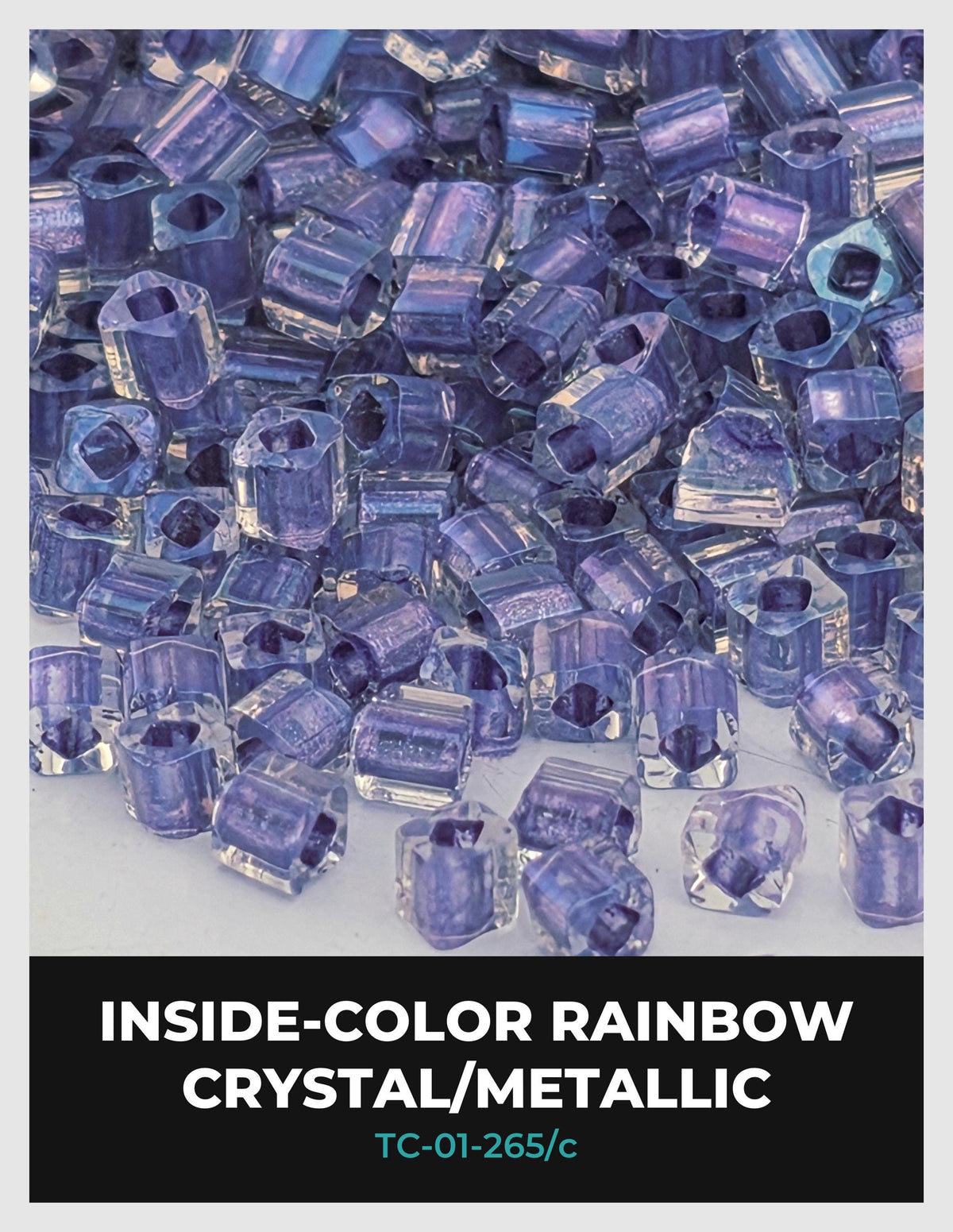 The image is a close-up of numerous clear crystal or metallic beads in various shades of purple, scattered across a surface.