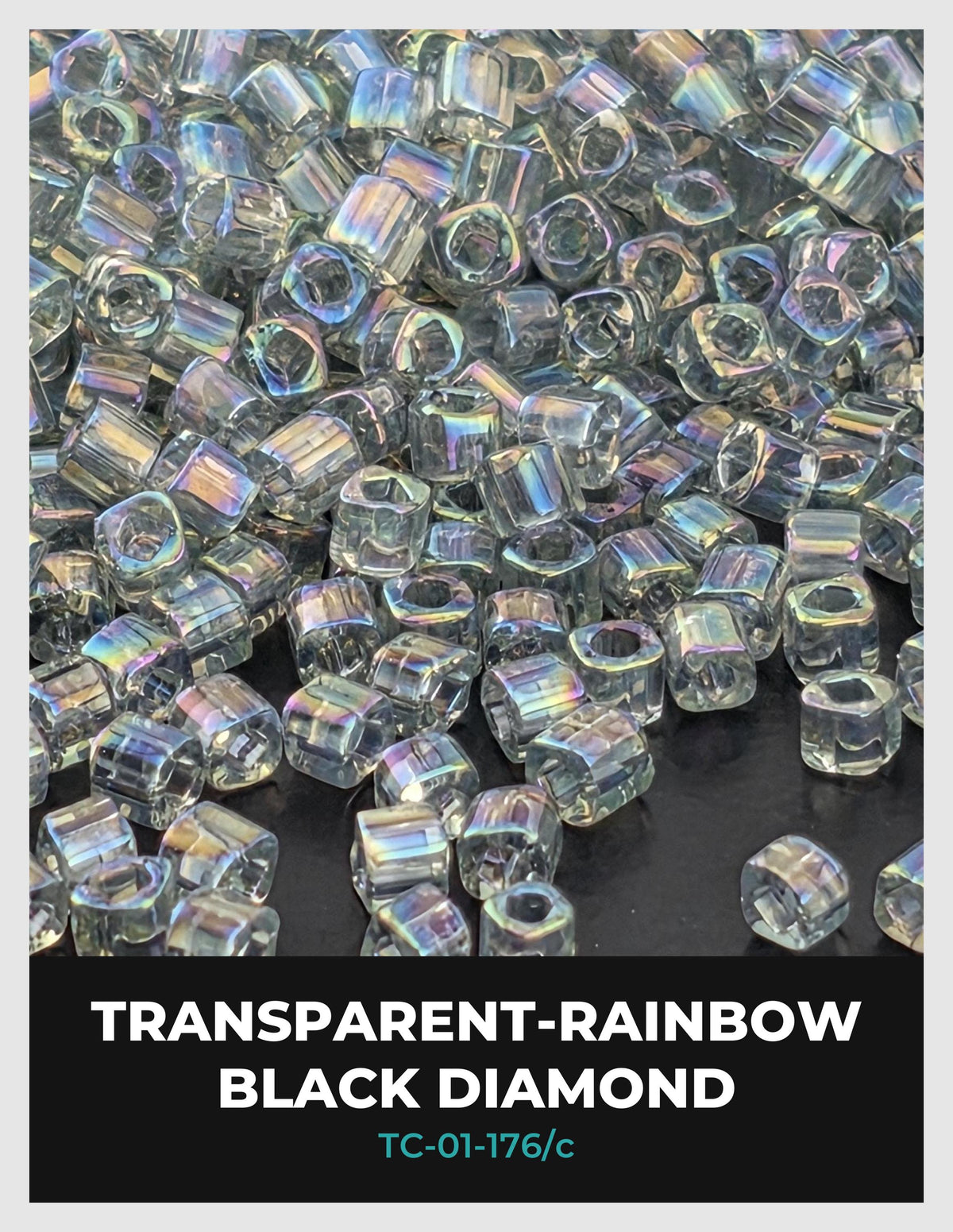 The image is a close-up of numerous transparent-rainbow black diamonds, with their iridescent colors and sparkling surfaces creating a visually captivating display.