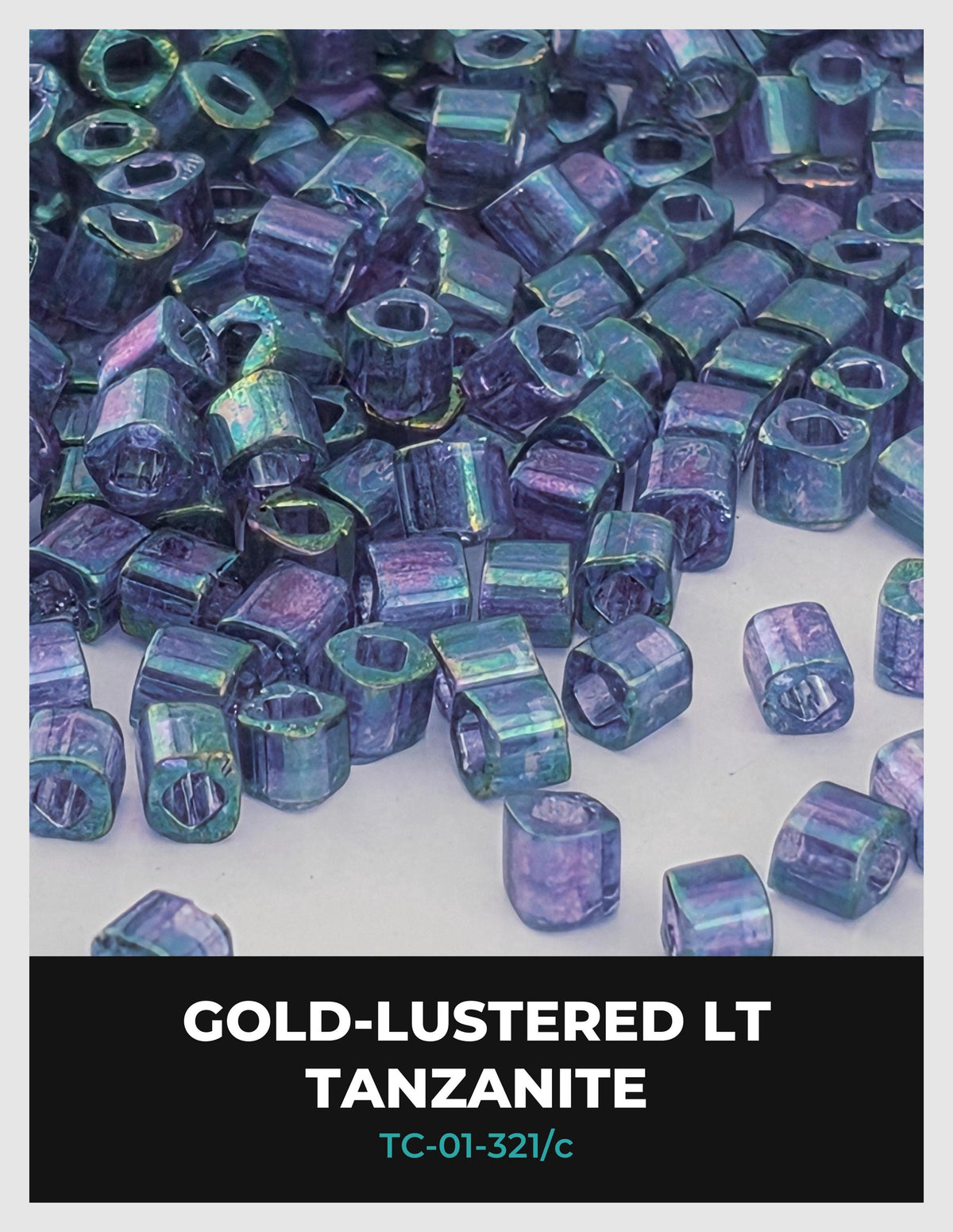a collection of small, colorful beads or stones, likely made of a shiny, metallic material. The beads appear to be gold-lustered and are scattered across a surface, creating a visually appealing and vibrant display.