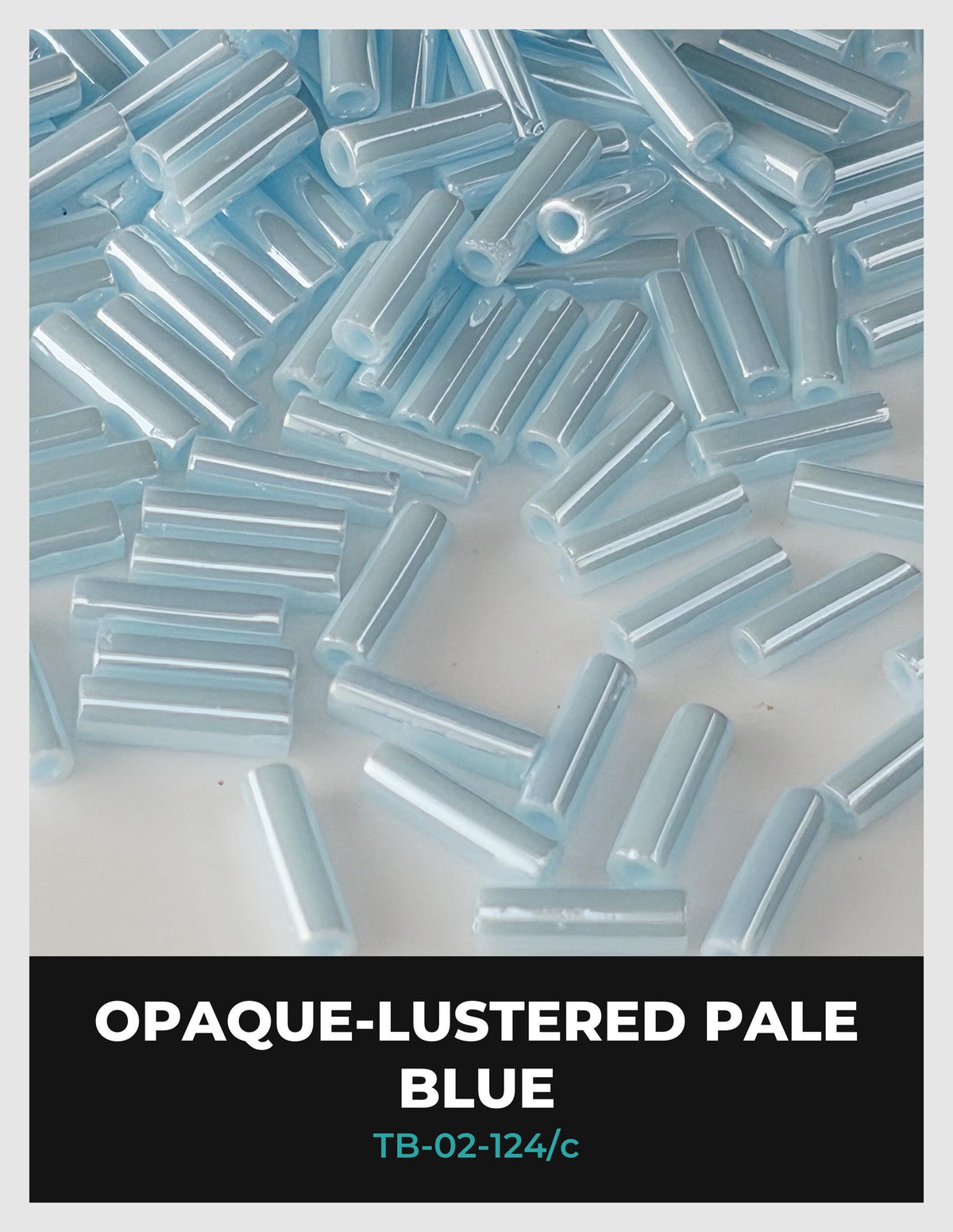 The image is a close-up of numerous light blue, glossy beads or tubes arranged in a visually appealing manner.