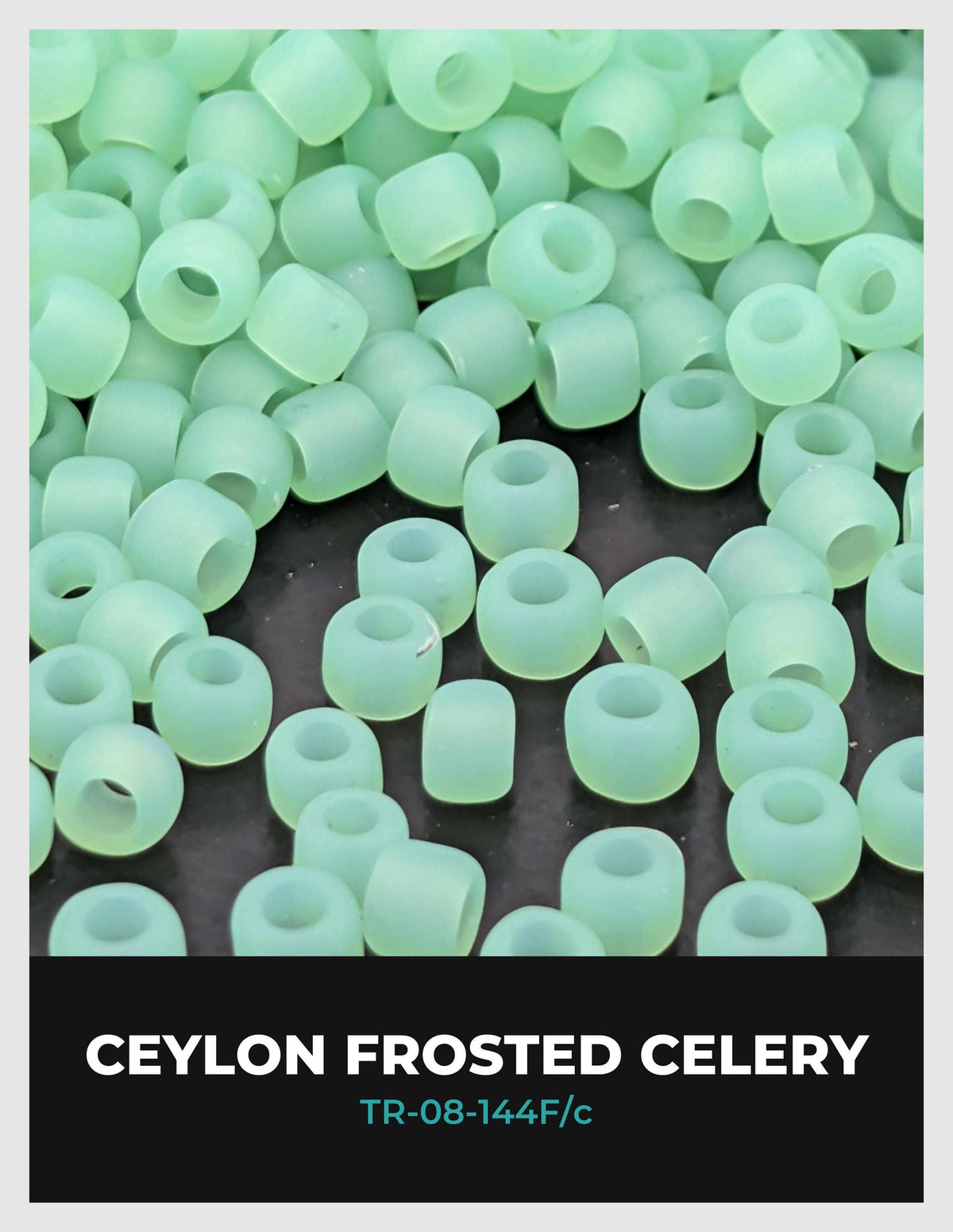 a collection of green, frosted celery beads scattered on a dark surface.