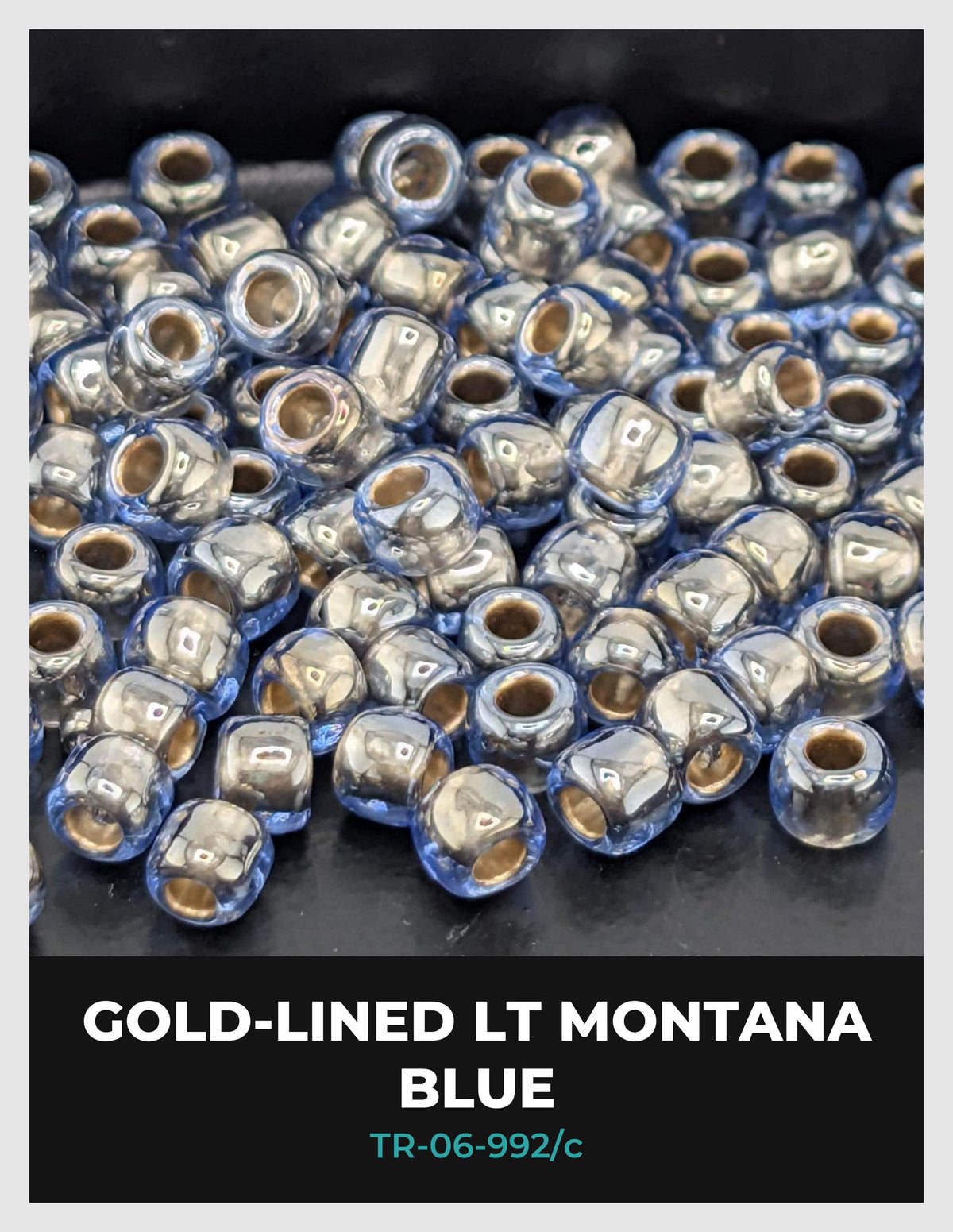 a collection of small, clear beads in various shades of blue, arranged in a visually appealing manner.