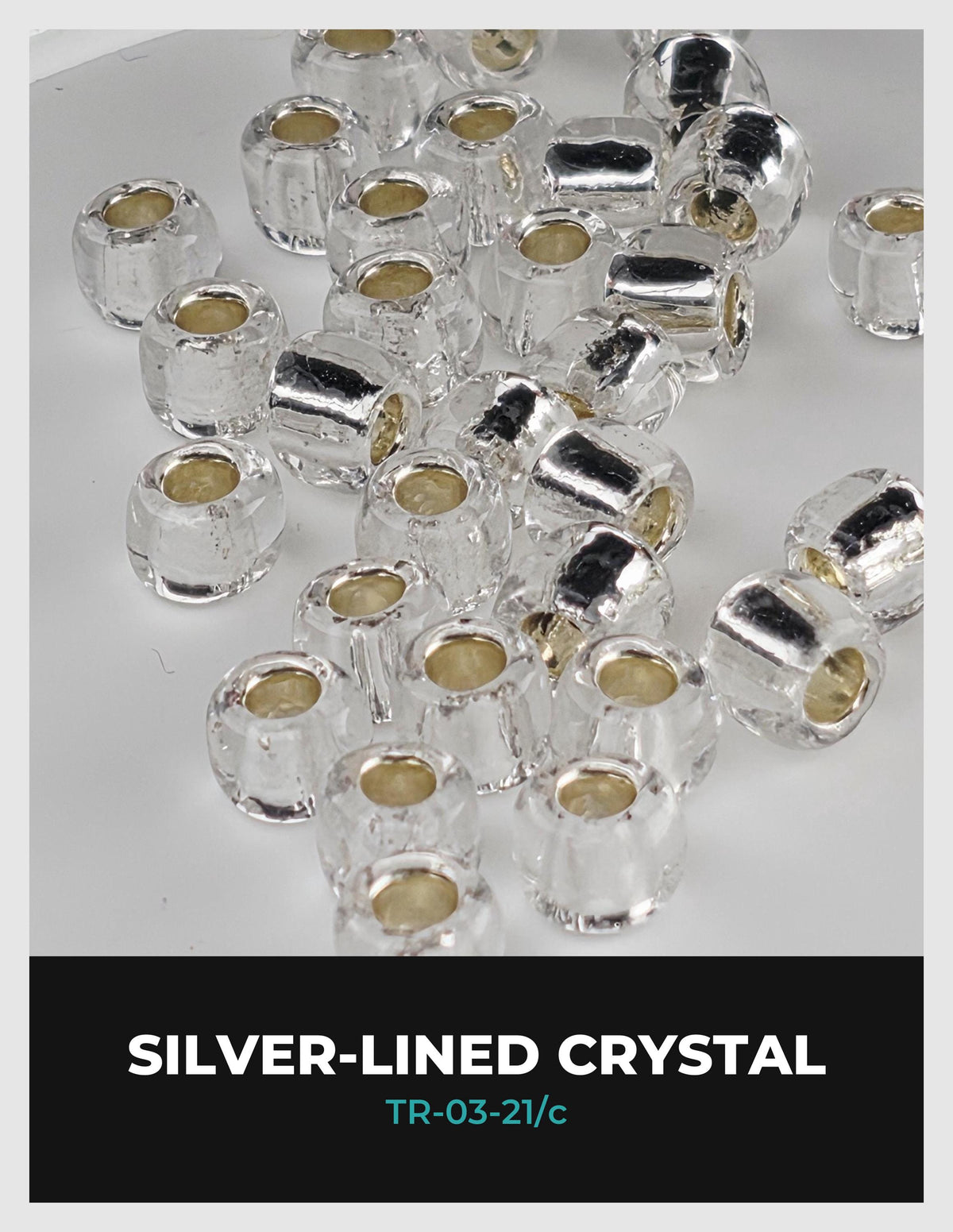 a collection of clear crystal beads in various shapes and sizes, arranged in a visually appealing manner.