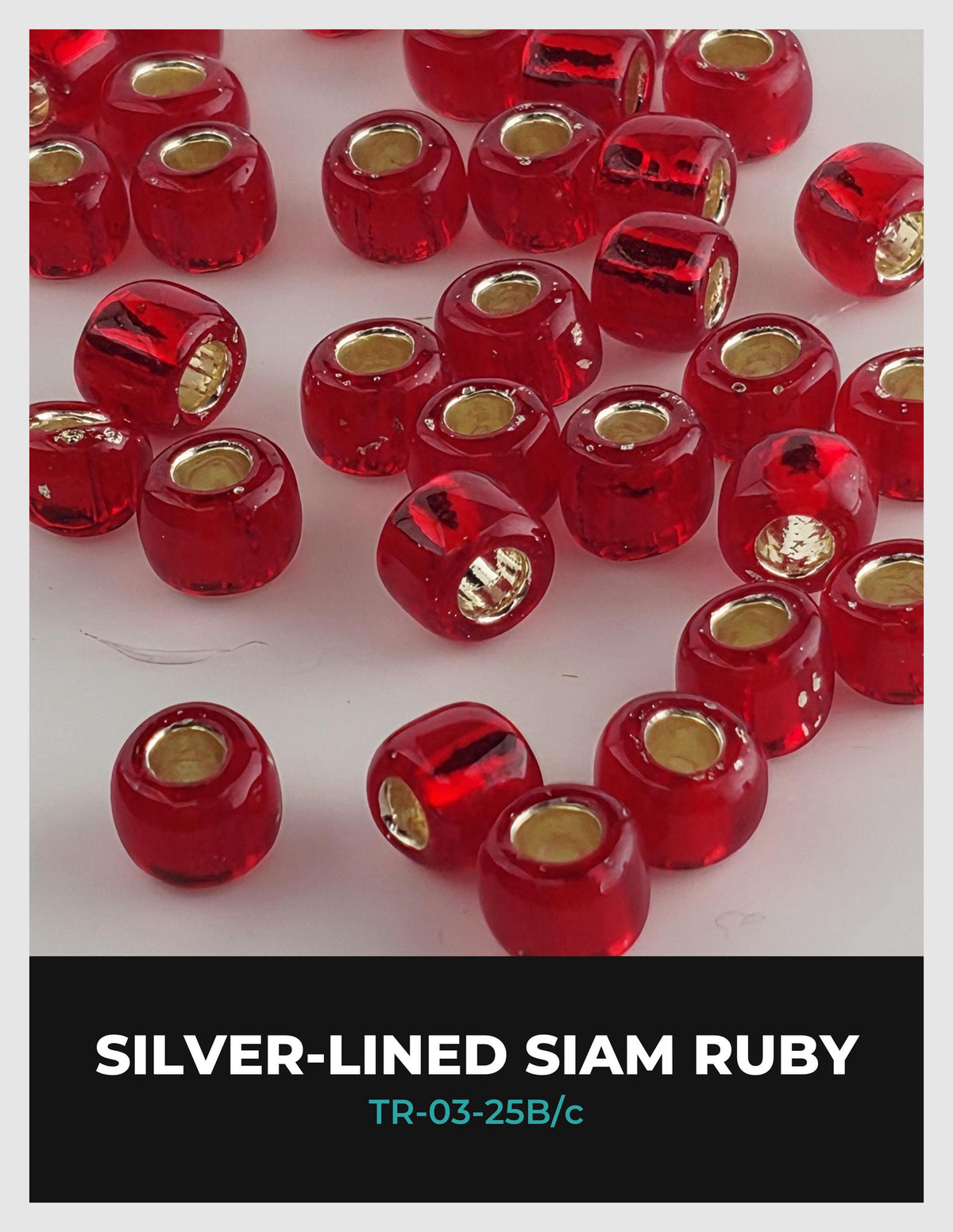 a collection of red glass beads with gold-colored centers, arranged in a visually appealing manner.