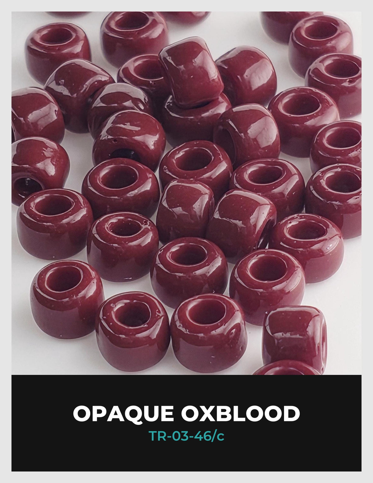 a collection of red, glossy beads or beads arranged in a pattern, with the text "OPAQUE OXBLOOD" and "TR-03-46/c" visible.