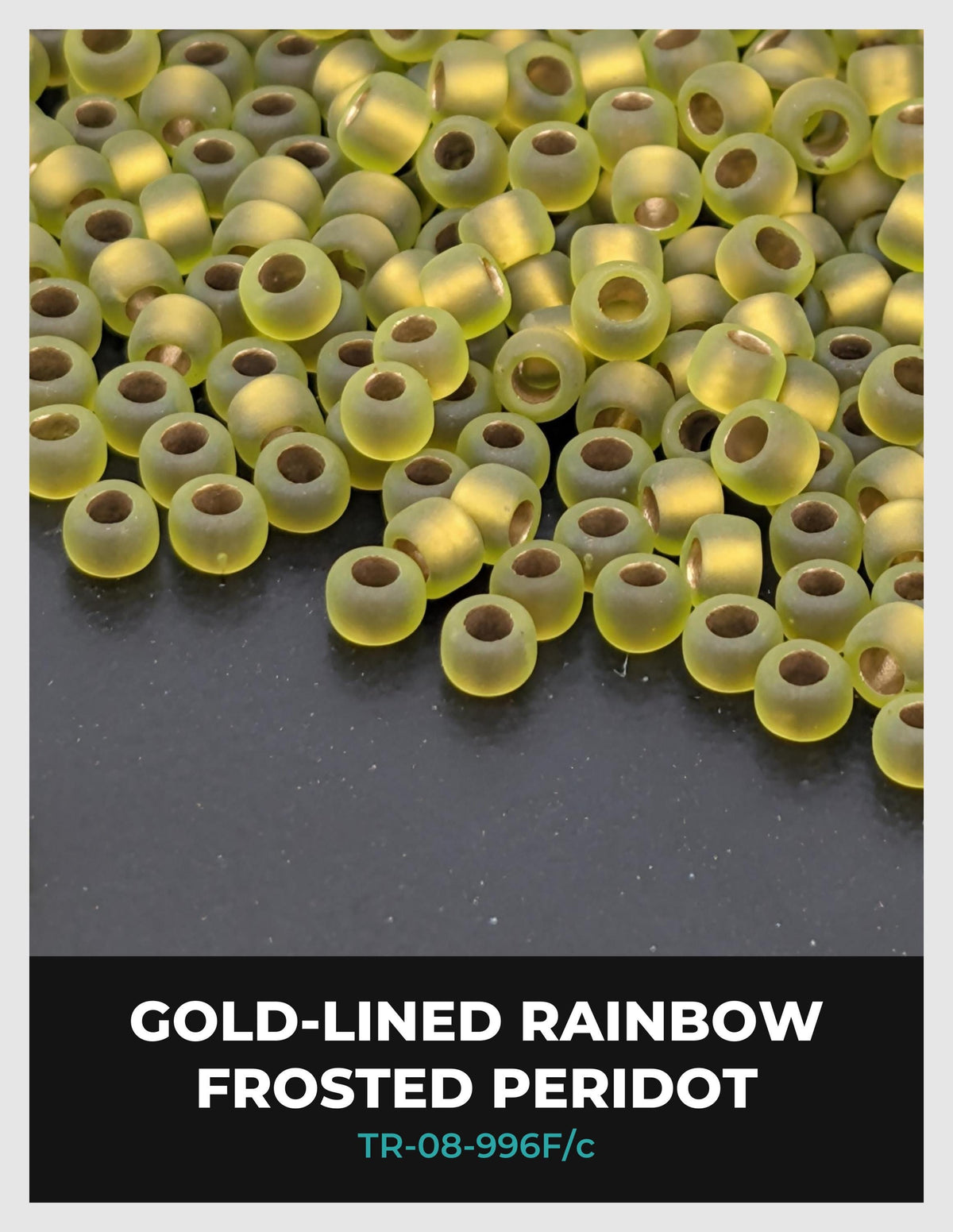 a collection of gold-colored, frosted, and peridot beads scattered on a dark surface.