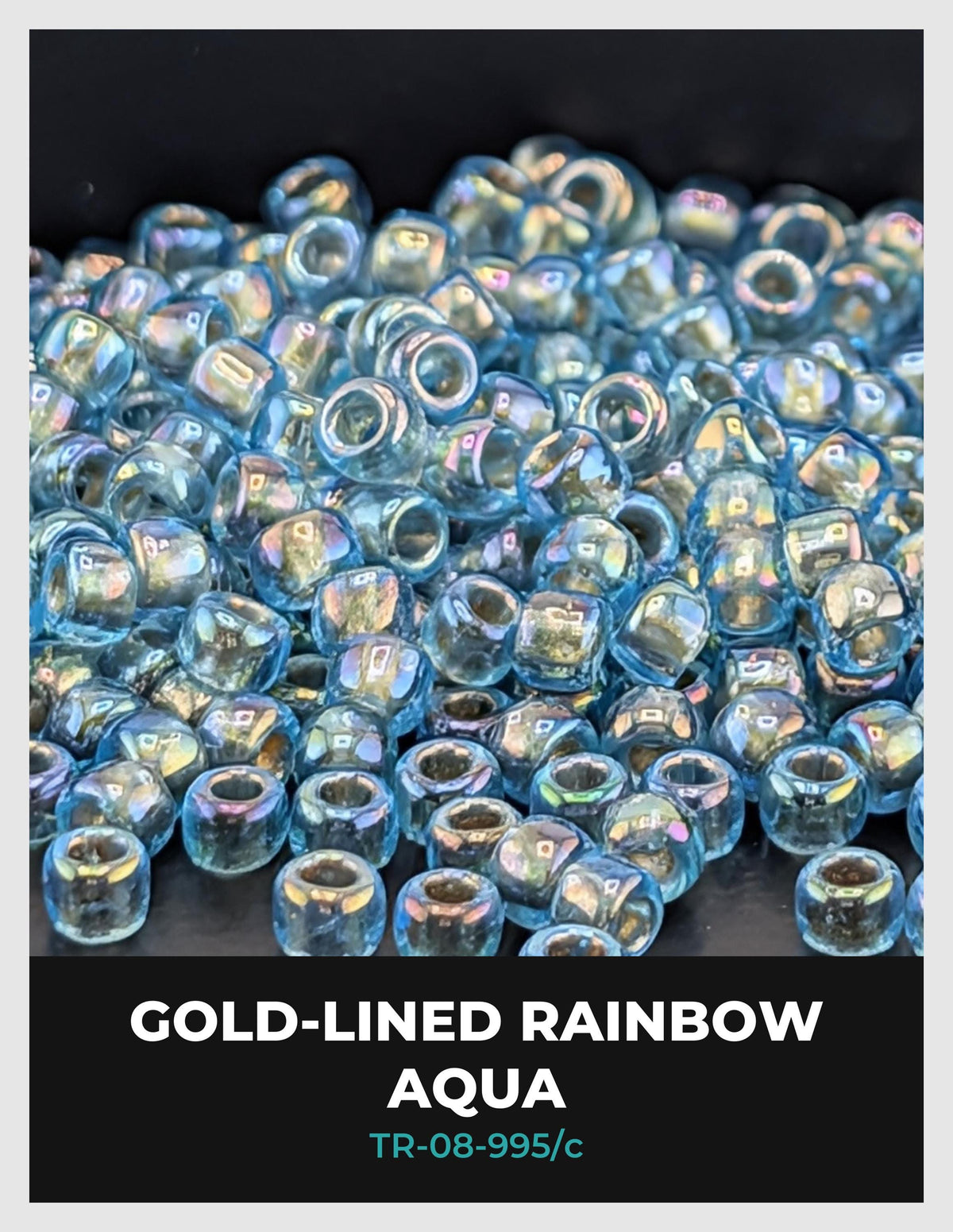 a collection of small, clear beads in various colors, including blue, green, and silver, arranged in a visually appealing manner.