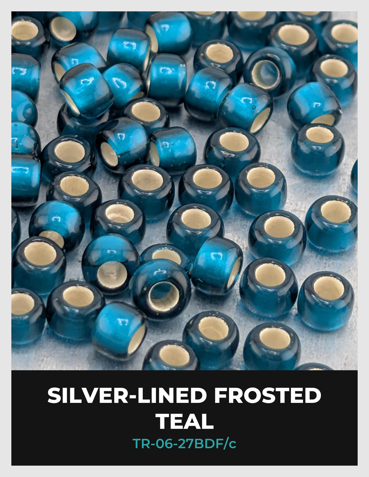 a collection of blue and white teal-colored beads or beads with white centers, arranged in a visually appealing manner.