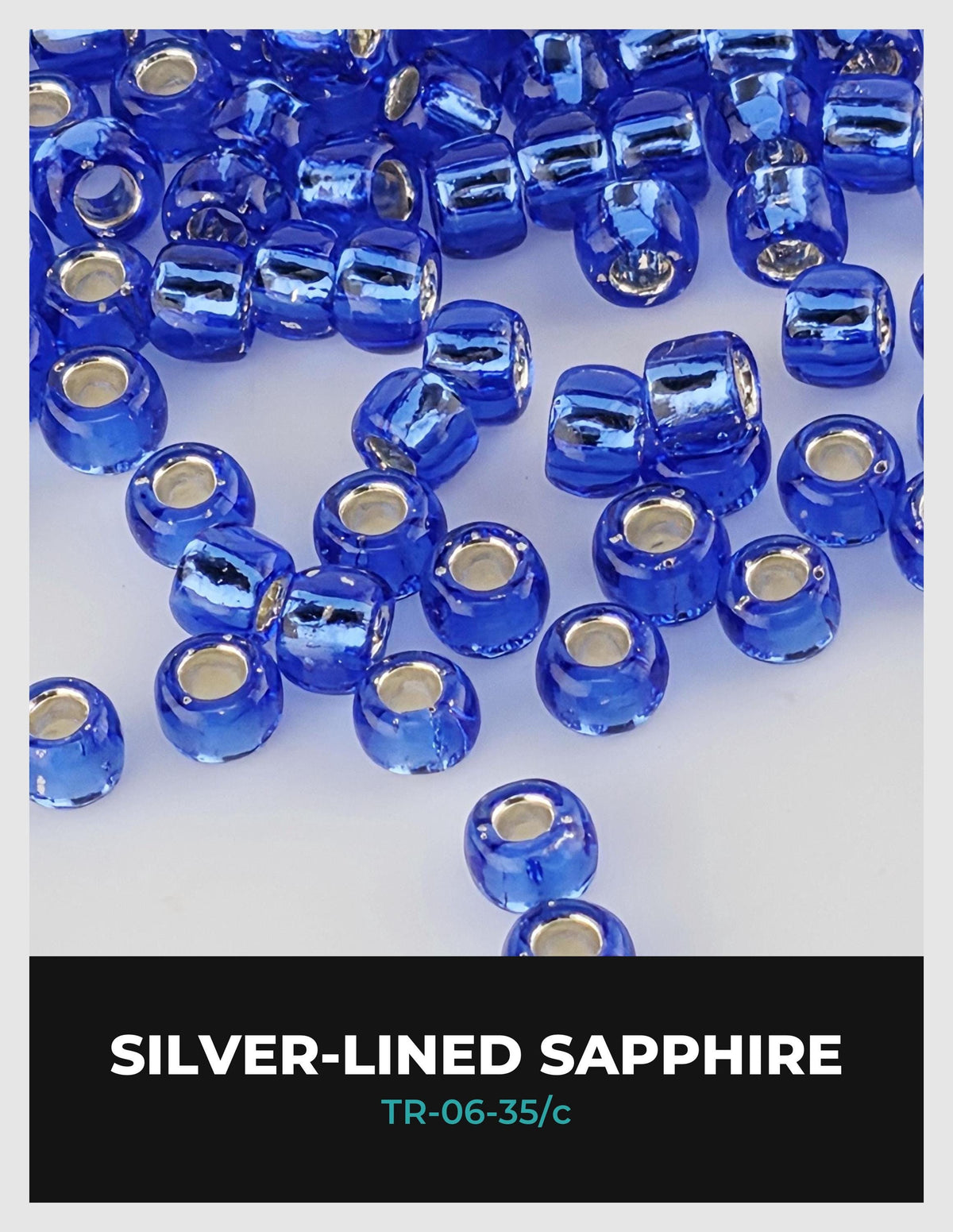 a collection of blue and silver-colored beads, with the silver beads scattered throughout the frame.