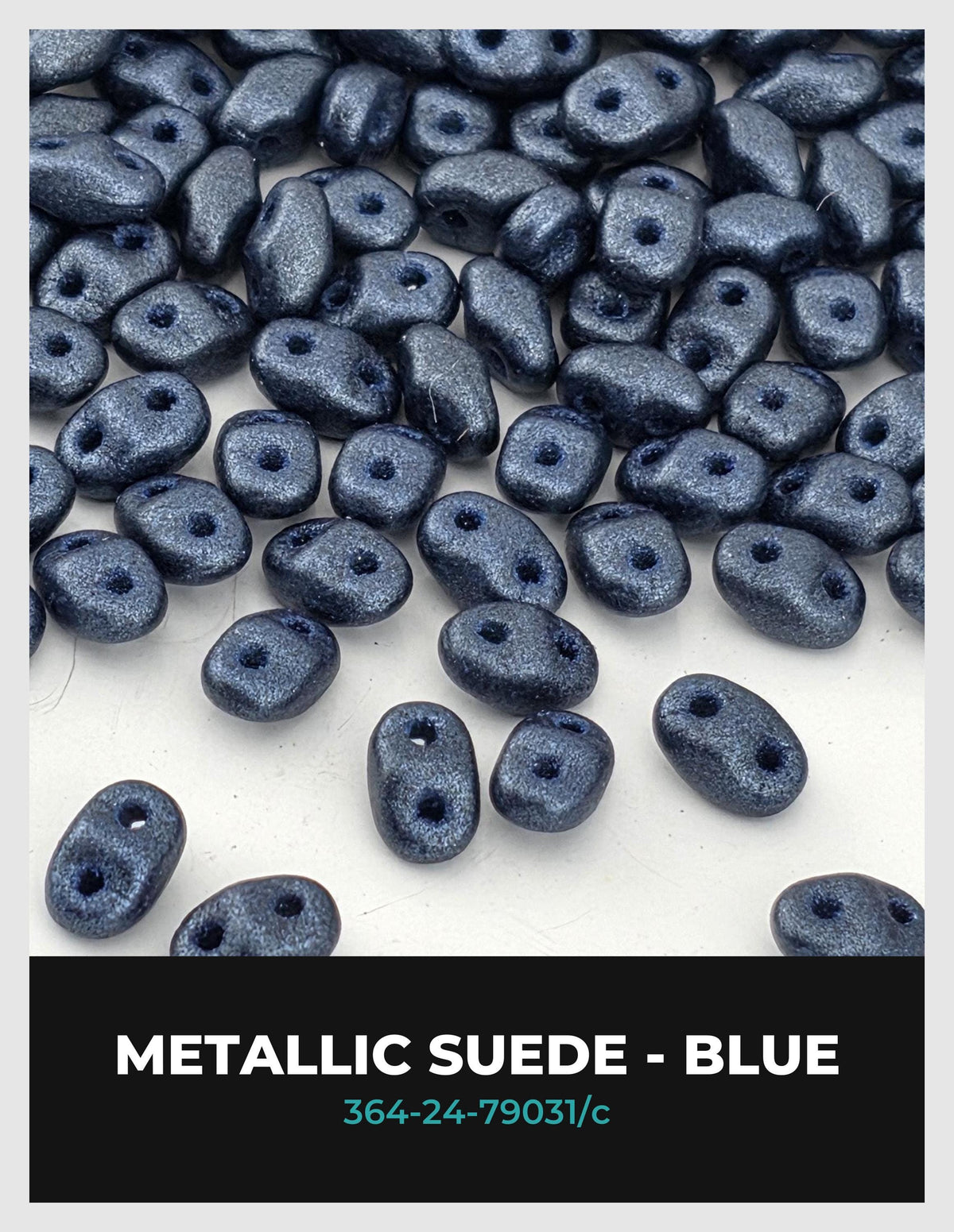 a collection of metallic suede beads in various shades of blue, scattered across a white background.