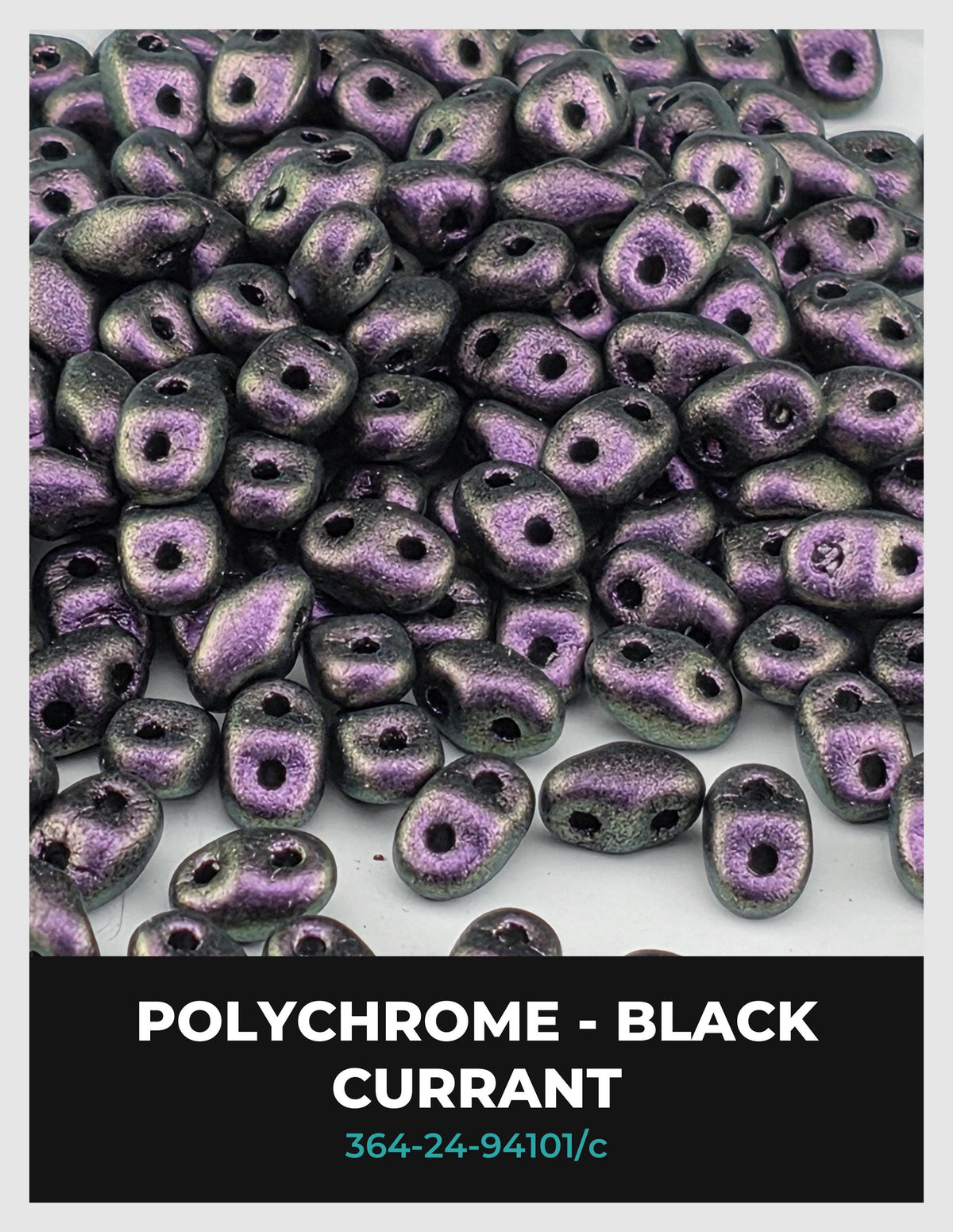 a pile of black, shiny beads with a purple hue, scattered across a white background.